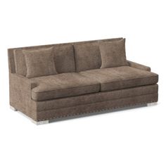 a brown couch sitting on top of a white floor