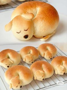 bread shaped like animals sleeping on top of each other in the shape of buns