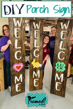 three people holding up wooden signs with the words welcome me and some flowers on them