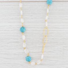 "This lovely new necklace is an authentic Nina Nguyen piece. This necklace has a retail price of $395. Gem: Natural Turquoise, Druzy Quartz Metal: Sterling Silver, 22k Gold Vermeil Weight: 35.5 Grams Stamps: Nina N 925 Style: Cable Chain, Linked Turquoise Closure: Lobster Clasp Chain Length: 45\" Adjustable Width: 12.2 - 11.1 mm Each piece is thoroughly examined and refinished as needed by our professional jewelers, graded by our in-house GIA (Gemological Institute of America) Graduate Gemologis Elegant Turquoise Necklace With Lobster Clasp, Elegant Turquoise Long Necklace For Gift, Elegant Long Beaded Turquoise Necklace, Turquoise Long Beaded Chain Necklace, Elegant Turquoise Long Necklace With Round Beads, Turquoise Beaded Long Necklace, Elegant Turquoise Beaded Long Necklace, Druzy Quartz, Natural Turquoise