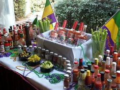 a table filled with lots of different types of condiments and bottles on it