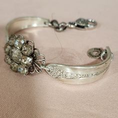 vintage bling accent adorning a silverware bracelet