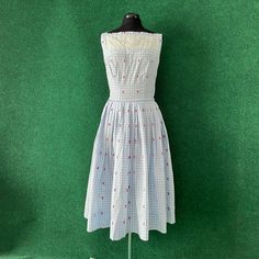 1950s cottagecore dream dress. Blue and white gingham fabric covered with tiny pink butterflies woven into the fabric, boat neckline with sweet lace panel on both the front and back of the dress and a satin band between the bodice and skirt. Dropped waist, pleated skirt. Metal side zip. There is an area of faint discoloration below the lace panel on the back. There are also some old hand sewn mends around the straps. No label, likely homemade. Measurements taken flat and doubled: Chest - 36" Waist - 28" Hips - free Length - 45" 1950s Cottagecore, 1950s Cottage, Brevard Nc, Farm Dress, Blue And White Gingham, Gingham Fabric, Upcycled Fashion, Pretty Clothes, Boat Neckline