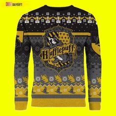 the harry potter christmas sweater is shown in grey and yellow, with an image of hogwart