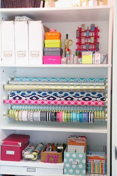 an organized closet with lots of craft supplies