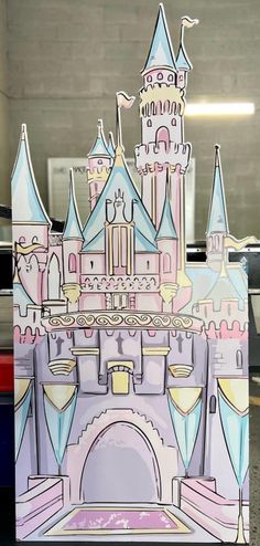 a cardboard cut out of a castle with turrets