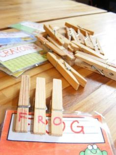 an image of wooden pegs and letters on a table with the word e - rog