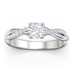 a white gold engagement ring with diamonds on it