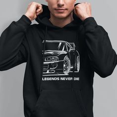 "Introducing the \"Legends Never Die\" hoodie, a blend of comfort and style for fans of classic speed. The hoodie features a notable Japanese sports car silhouette, with the powerful statement, \"Legends Never Die\" beneath it. Crafted from premium, cozy material, the black and white design makes the car the centerpiece, catching the eye of every car lover. It's more than just a clothing item--it's a conversation starter and a statement piece. This hoodie is the perfect gift for your boyfriend, Gifts For Car Guys Boyfriends, Car Hoodie Design, Gift Ideas For Car Guys, Gifts For Car Guys, Bleach Hoodie