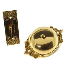 a golden door handle and knob on a white background