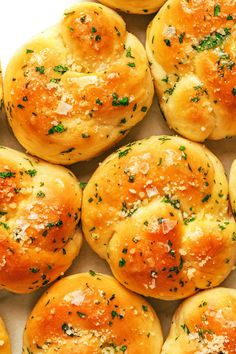 freshly baked bread rolls covered in cheese and herbs