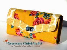 a yellow purse with flowers on it