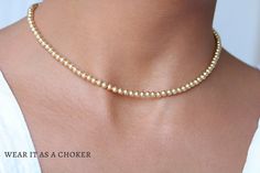 "A dainty, feminine, and adjustable 18k Gold laminate layering necklace.  Please note: this listing is for one chain only. The model in the pictures is layering it with other necklaces. Layer it too and take your outfit to the next level!  D E T A I L S  * Box Link Balls Necklace. * Material: 18k Gold Filled laminate * Chain Width: 1mm. * Beads Measure: 4mm. * Fine finish   C H A I N  L E N G T H  14.5\" long  plus adjustable 4\" extension.  18K  G O L D  F I L L E D   Fine finish 18k gold-fille Dainty Gold Beads Choker As A Gift, Dainty Gold Beaded Choker As Gift, Dainty Gold Beaded Choker, Delicate Gold Choker With Tiny Beads, Dainty Gold Choker With Round Beads, Hare Necklace, Leaping Hare, Running Hare, Rabbit Necklace