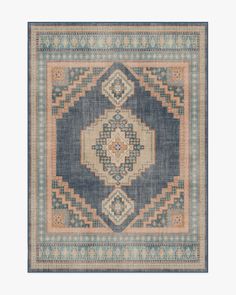 a blue and beige rug with an ornate design on the bottom, in different colors