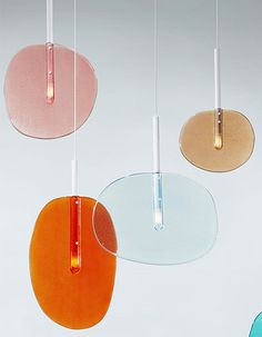 four different colored lights hanging from the ceiling