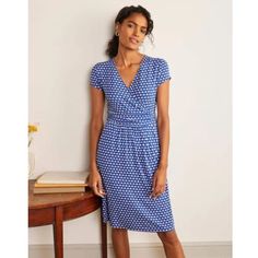 Boden Lola Jersey Knit Faux Wrap V-Neck Fit & Flare Blue Dress Size 8p. With Its Crossover V-Neckline And Figure-Cinching Ruched Waistband, This Feminine Wrap Dress Is Ready To Create A Seriously Smooth Shape. It's Crafted From A Jersey Blend For Stretchy Softness And Features A Vibrant Blue-And-White Print To Add An Always-Welcome Pop Of Colour To Your Wardrobe. Soft 95% Viscose 5% Elastane Jersey Knit Material. Blue And White Scallop Print. V-Neck. Faux Wrap Front. Short Cap Sleeves. Ruched Dr Jersey Wrap Dress, Printed Jersey Dress, Boden Women, Red Midi Dress, Summer Clothing, Dress Shapes, Capped Sleeve Dress, Vibrant Blue, Grey Blue