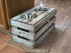 two wooden crates stacked on top of each other with one bowl and the other empty