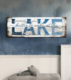 a wooden sign that says lake is better to wake at the end of the day