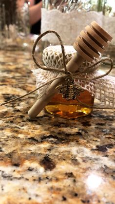 a jar filled with honey sitting on top of a counter