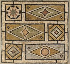 an old mosaic with different designs on it