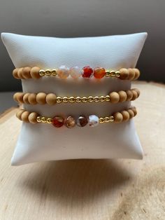 Our PUMPKIN SPICE stack! These are super stylish, comfortable and perfect for FALL! Such a trendy boho-look! (These are meant to fit snug. If you would like them to feel loose and move around on your wrist, please size up). Each bracelet is carefully handmade with high quality materials: -6mm natural Agate stones in Fall colors -6mm natural wood beads -3mm gold hematite beads -7mm black/gold acrylic letters -Cord: high-quality, durable, stretch cord with reinforced knots and specialty glue ⭐️⭐️W Gold Bracelets With Wooden Beads For Healing, Handmade Natural Wood Beaded Bracelets, Natural Wood Round Beads Bracelet Gift, Casual Gold Beaded Bracelets With Gemstone, Gift Natural Wood Round Bead Bracelets, Gift Natural Wood Round Beads Bracelet, Handmade Agate Beaded Bracelets For Everyday, Everyday Handmade Agate Beaded Bracelets, Spiritual Adjustable Natural Wood Beaded Bracelets