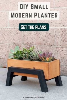 a wooden planter with succulents in it and the words diy small modern