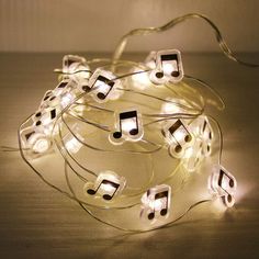 a string of musical notes is lit up with lights