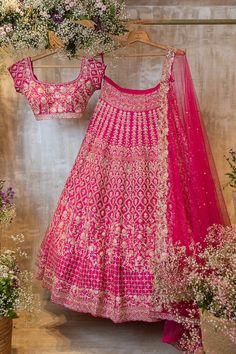 The Nazia lehenga features a bright pink lehenga that is hand-embroidered with fine glass beads, pearls, and thread. It is paired with a matching blouse and dupatta.by Chamee and Palak. DELIVERY TIMEPlease allow 8-12 weeks for your outfit to arrive. FABRIC DETAILSRaw silk, Net. Pink Chandbali Choli With Intricate Embroidery, Pink Semi-stitched Raw Silk Choli, Pink Lehenga With Dori Work In Raw Silk, Pink Raw Silk Lehenga With Dori Work, Pink Raw Silk Lehenga For Navratri, Pink Raw Silk Choli For Navratri, Pink Kundan Dupatta With Intricate Embroidery, Pink Bollywood Raw Silk Choli, Pink Raw Silk Bollywood Choli