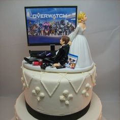 a wedding cake with a bride and groom on top