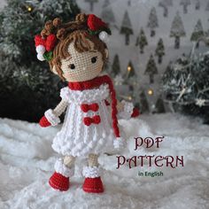 a crocheted doll is standing in the snow with her hands on her hips