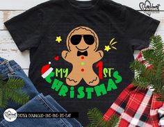 a black shirt with a ginger wearing sunglasses and the words my 1st christmas on it