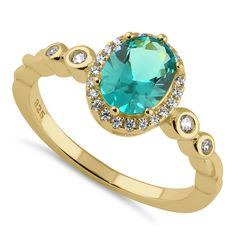 Top of Ring Height: 9.8mm

Top of Ring Width: 8.5mm

Shank Width: 1.8mm


Stone Material: Teal Cubic Zirconia
Clear Cubic Zirconia

Stone Size: 6.0mmx8.0mm (Oval-Teal)
1.75mm
1.5mm
1.0mm

Stone shape: Oval
Round

Stone Carat Weight: 1.21 ct. (Oval-Teal)
0.02 ct.
0.015 ct.
0.005 ct.

Total Number of Stones: 27

Stone Setting: Prong


Metal: 925 Sterling Silver

Plating: Yellow Gold

Finish: High Polish Oval Cubic Zirconia Birthstone Ring With Halo Setting, Oval Cubic Zirconia Birthstone Ring With Halo, Oval Halo Birthstone Ring With Cubic Zirconia, Stone Material, Stone Setting, Halo Ring, Halo Rings, Stone Settings, Oval Cut