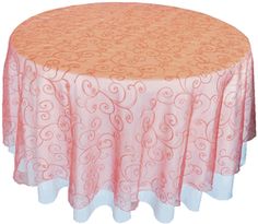 an orange and pink table cloth with swirls on it