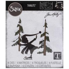 an image of a person skiing in the snow with trees behind them and text that reads sizzix