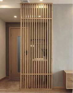 a room divider made out of wooden slats