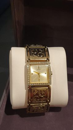 Guess Quartz Dress Ladies' Watch is featuring a champagne coloured Dial,  adorned with golden hands & baton hour markers  framed by a row of crystals S/Steel gold-plated rectangle Case is measuring 22mm x 27mm,  signed & numbered at the back  Sturdy S/Steel & gold-plated Bracelet that would fit 19.5cm wrist  Quartz Japan Movement  (with new battery) In great condition Gold Rectangular Analog Watch, Rectangular Gold Analog Watch, Gold Analog Watch With Rectangular Face, Gold Rectangular Analog Jewelry And Watches, Gold Diamond Watch With Rectangular Dial, Gold Diamond Watch With Rectangular Case, Gold Diamond Watch With Rectangular Shape, Gold Diamond Watch With Rectangular Face, Rectangle Watch