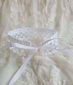 This crochet white lace choker necklace is tied with a white satin ribbon. A simple yet elegant accessory that will work well with a lot of looks. The choker is similar to the Victorian lace collar. Teenagers, who prefer clothes in the Gothic style, also like to wear them to emphasize their individuality. The choker can be used as an additional accent for creating costumes for Cosplay. Made from 100% high-quality mercerized cotton. Choker length 32 cm / 12,6 inches, width - almost 4 cm / 1,5 inc Lace Choker With Lace Trim As Gift, White Lace Choker Gift, Delicate White Choker For Parties, Adjustable White Choker For Party, White Lace Wedding Choker, Crochet Lace Choker, White Lace Choker, Crochet Lace Collar, White Choker