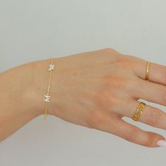 "Butterfly and Letter Bracelet!  Dainty, chic, and compliments any style! Each piece is handmade and crafted in our atelier just for you!  Made from 925 Sterling Silver with options of 14K Gold and Rose Gold Vermeil. Feel free to message me with any questions or for more details! We love hearing from you! :)  Jewelry pouch included with purchase. At Evva's handmade shop we know you'll find something lovely for yourself or to give as a gift to someone special! CURRENT PRODUCTION TIMES All items are handmade and made to order so please check our policies page for the most up to date production and delivery times. If you need it sooner, please send us a message on Etsy, we can prepare your item as fast as possible for your needed date. PACKAGING - If certain pieces are intended as gifts, plea Dainty Bracelets With Initials For Personalized Gifts, Minimalist Custom Name Bracelets, Mother's Day Name Bracelet With Initials, Mother's Day Initials Name Bracelet, Dainty Adjustable Bracelet With Initials, Dainty Adjustable Name Bracelet With Initials, Trendy Initials Bracelet For Gifts, Initials Name Bracelet For Gift, Trendy Adjustable Bracelets With Initials