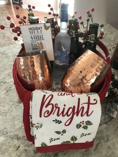 a holiday basket filled with alcohol and wine