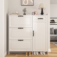 a white cabinet with two doors and some shoes on the bottom shelf next to it