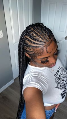 a woman with long box braids in her hair