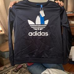 Size Medium Beautiful Satin Adidas Sweatshirt It Does Not Stretch Casual Crew Tops With Three Stripes Branding, Blue Adidas Long Sleeve Tops, Adidas Blue Long Sleeve Tops, Navy Adidas Sporty Top, Adidas Navy Sporty Tops, Navy Sporty Adidas Tops, Sporty Navy Adidas Tops, Casual Navy Tops With Three Stripes Branding, Adidas Long Sleeve Top With Logo Print