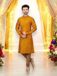 Comes with top and bottom Fabric - Silk Step into the world of festive celebrations with our Festive Wear Kurta Pajama. The vibrant mustard color adds a touch of radiance and joy to your attire, perfect for special occasions and cultural festivities. Crafted with precision and attention to detail, this ensemble showcases a perfect blend of tradition and modern style. Please take note of the following important information regarding the sizing of this Kurta: The chest sizes of this Kurtas is approximately 4 inches larger than the actual Kurta size. For instance, if you select a size 40 Kurta, it will have a chest size of approximately 44 inches or thereabouts. To ensure a comfortable fit and accommodate for different body types, we recommend considering purchasing Kurtas that are 2 inches b Festive Mustard Straight Kurta, Mustard Straight Kurta For Diwali, Mustard Traditional Wear For Festivals, Orange Long Sleeve Kurta For Diwali, Festive Mustard Traditional Wear For Festivals, Orange Kurta With Pallu For Festivals, Gold Kurta For Diwali Celebration, Festive Mustard Sets For Diwali, Festive Mustard Sets For Eid