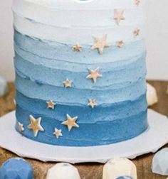 a blue and white cake with stars on it