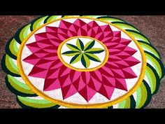 a colorful flower design is on the ground