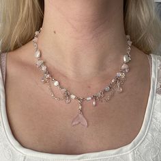 A handmade, 20in beaded necklace featuring pink freshwater pearls, morganite, selenite, preciosa crystals, Czech glass, and glass beads! Also made with other nickel-free materials, so it is safe for sensitive skin! To measure around your neck, use a piece of thread, rope, or cable, and apply the measured length to a standard ruler or measuring stick. This necklace is 20in with a 2in chain, totaling 22in, but please don't hesitate to ask me to lengthen it! I will happily do so for no additional cost.  Each necklace is individually handmade, so there may be some variation in bead colors. No two are exactly the same! There may also be some color discrepancies between the real necklace and how it appears on monitors/screens. Whimsical Pearl Beaded Necklace, Mermaid Beaded Necklace, Mermaid Necklaces, Ocean-inspired Beaded Shell-shaped Necklace, Mermaid Necklace Beads, Mermaid Tsil Necklace, Measuring Stick, Handmade Mermaid-shaped Ocean-inspired Necklaces, Handmade Mermaid