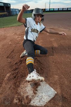 a female softball player in action on the mound