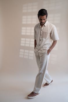 This Dawning Flap Shirt comes in a calm and soothing color. This Kala Cotton shirt is undyed and unbleached. It comes with pin-tuck details along with fagoting stitch detail at the back. Intricate Kantha, a form of Indian hand embroidery adorns the extra fabric flap on the pocket. *This item is a final sale and not eligible for returns or exchanges. *This item can take up to 14 business days to ship as it is made to order for you. Beige Relaxed Fit Shirt For Casual Gatherings, Neutral Short Sleeve Cotton Shirt, Luxury Relaxed Fit Shirt With Flap Pockets, Neutral Cotton Shirt With Relaxed Fit, Relaxed Fit Cotton Shirt With Natural Dye, Cream Cotton Shirt With Relaxed Fit, Casual Shirt With Natural Dye And Relaxed Fit, Luxury Men's Shirt With Flap Pockets, Unstructured Cotton Shirt With Flap Pockets