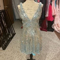 Light Blue And Silver Homecoming Dress. Worn Only Twice. Super Sparkly Light Blue V-neck Evening Dress For Party, Glamorous Light Blue Evening Dress For Party, Light Blue V-neck Party Evening Dress, Elegant Silver Sequin Homecoming Dress, Blue Embellished V-neck Mini Dress, Silver Sequined Evening Dress For Homecoming, Silver Sequin Dress For Homecoming, Sparkling Silver Sequin Dress For Homecoming, Silver Sparkling Sequin Dress For Homecoming