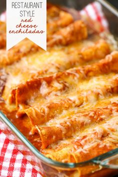 a cheesy enchilada in a casserole dish on a red and white checkered tablecloth